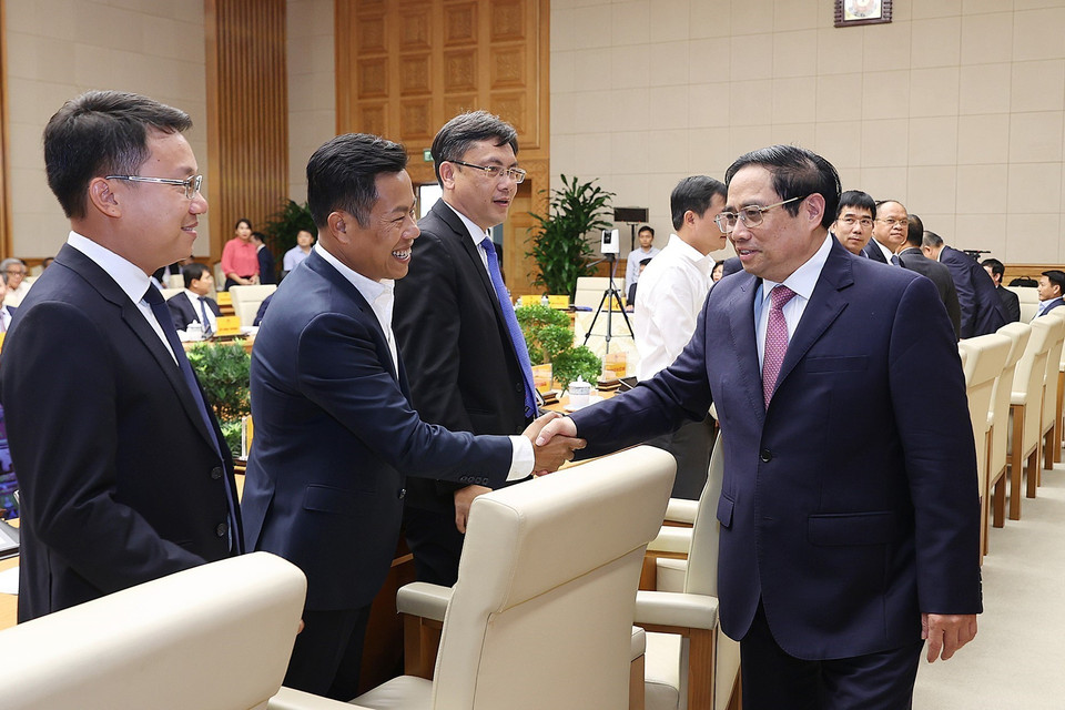 Thủ tướng Phạm Minh Chính với các đại biểu dự hội nghị phát triển thị trường khoa học và công nghệ. (Ảnh: Dương Giang/TTXVN)