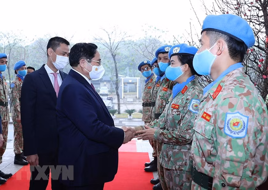 Thủ tướng Phạm Minh Chính với các đại biểu kiều bào dự Xuân quê hương năm 2022. (Ảnh: Dương Giang/TTXVN)