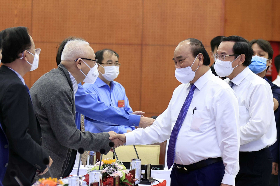 Chủ tịch nước Nguyễn Xuân Phúc và các đại biểu tham dự hội thảo. (Ảnh: Thống Nhất/TTXVN)