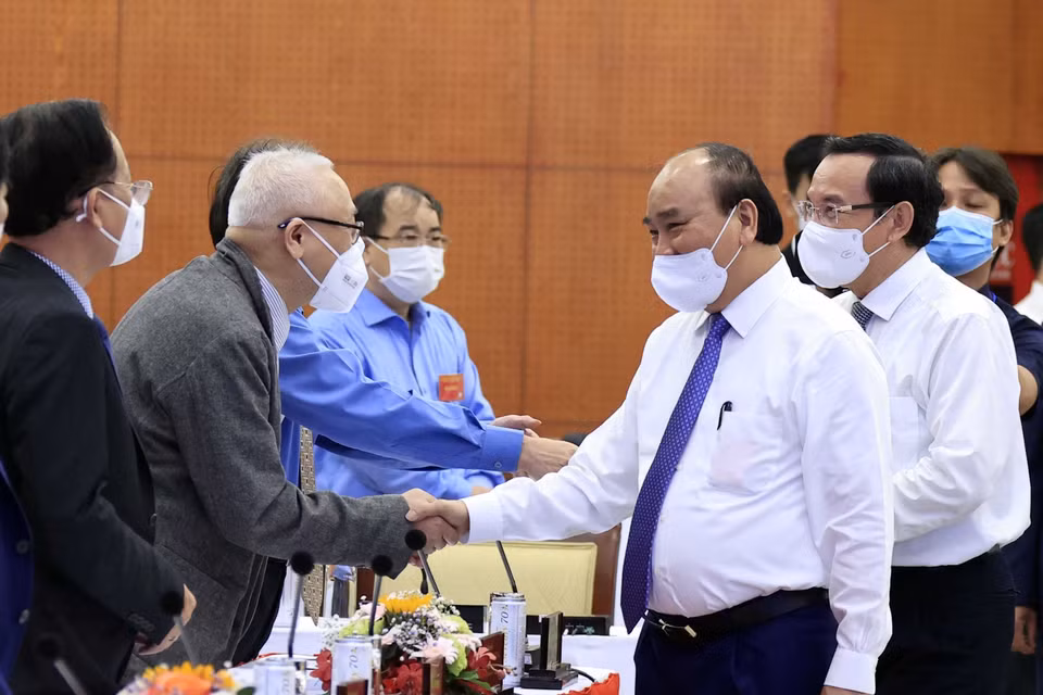 Chủ tịch nước Nguyễn Xuân Phúc và các đại biểu tham dự hội thảo. (Ảnh: Thống Nhất/TTXVN)