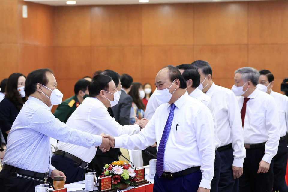 Chủ tịch nước Nguyễn Xuân Phúc và các đại biểu tham dự hội thảo. (Ảnh: Thống Nhất/TTXVN)