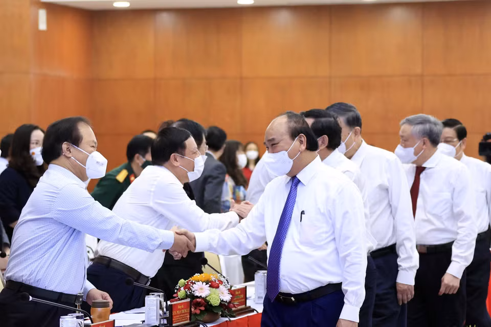 Chủ tịch nước Nguyễn Xuân Phúc và các đại biểu tham dự hội thảo. (Ảnh: Thống Nhất/TTXVN)