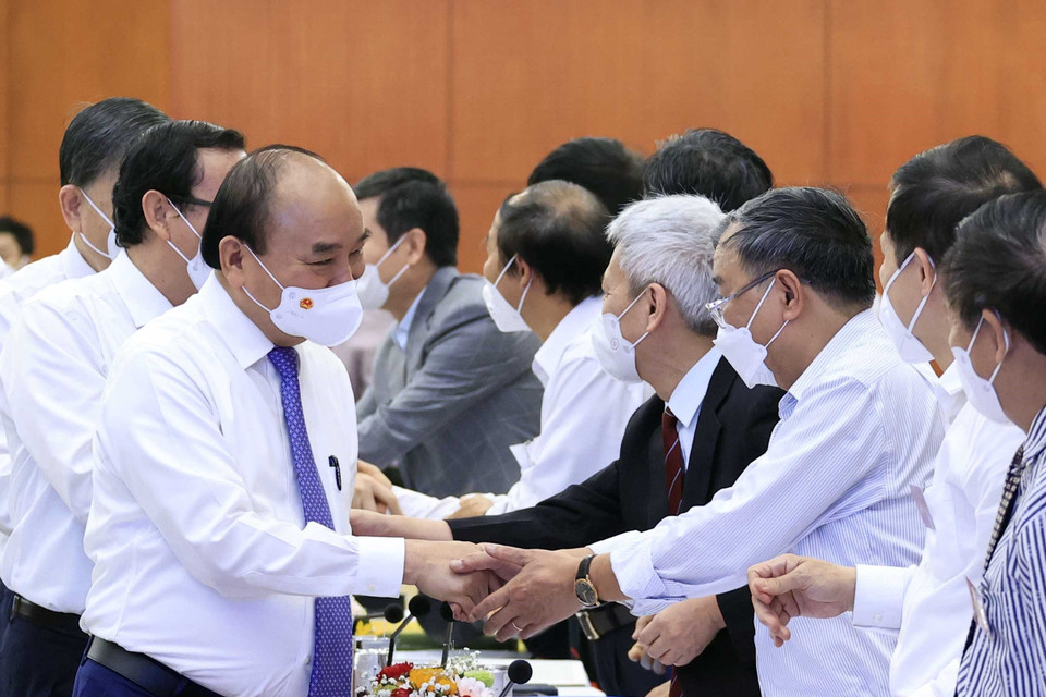 Hình ảnh Chủ tịch nước Nguyễn Xuân Phúc và các đại biểu tham dự hội thảo. (Ảnh: Thống Nhất/TTXVN)