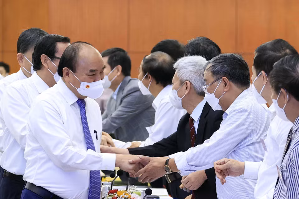 Hình ảnh Chủ tịch nước Nguyễn Xuân Phúc và các đại biểu tham dự hội thảo. (Ảnh: Thống Nhất/TTXVN)