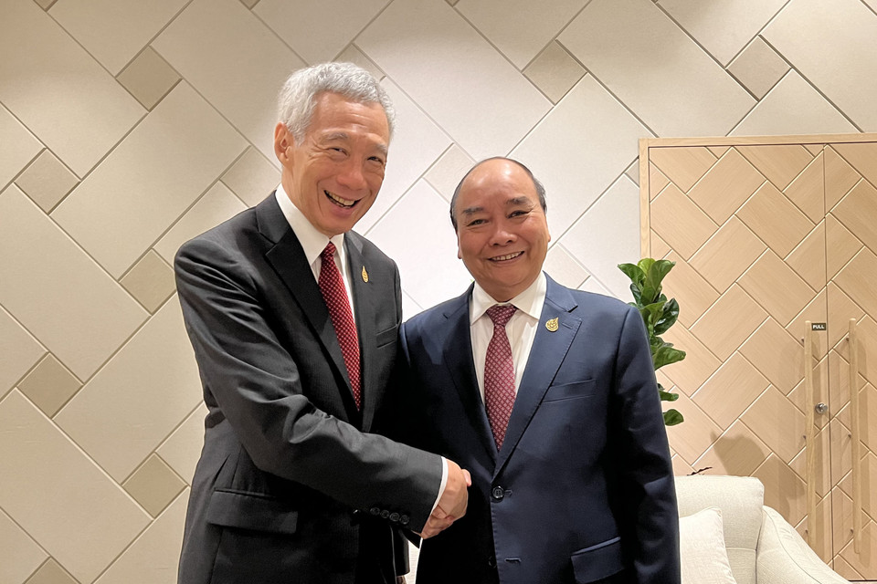 Chủ tịch nước Nguyễn Xuân Phúc và Thủ tướng Singapore Lý Hiển Long. (Ảnh: Thống Nhất/TTXVN)