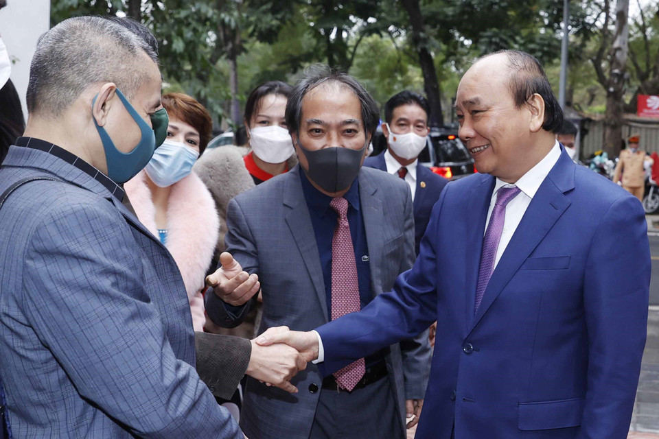 Chủ tịch nước Nguyễn Xuân Phúc tới dự Lễ phát động sáng tác văn học về đề tài thiếu nhi. (Ảnh: Thống Nhất/TTXVN)