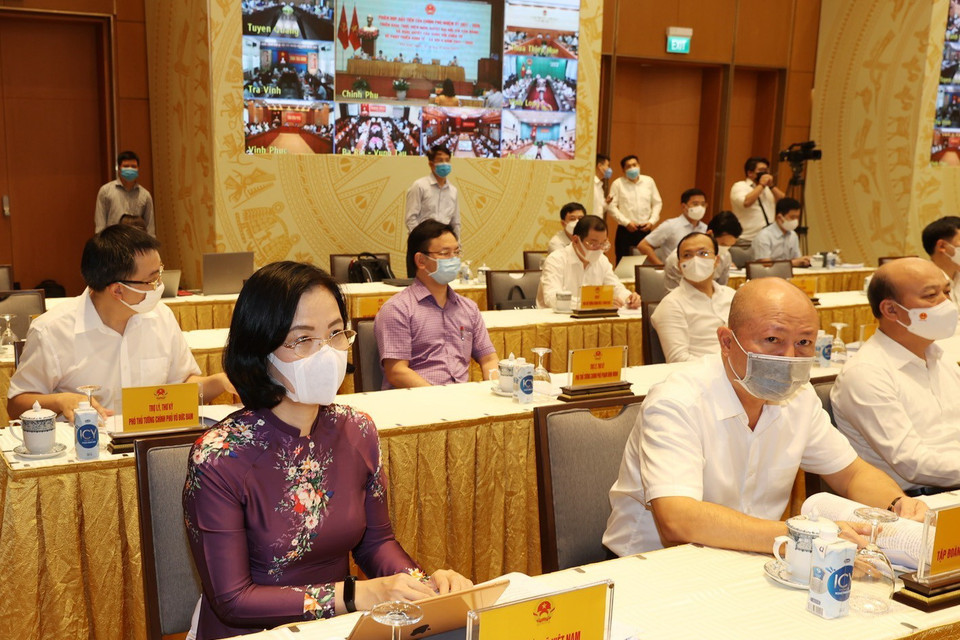  Phó Tổng giám đốc Thông tấn xã Việt Nam Vũ Việt Trang cùng các vị lãnh đạo Đảng, Nhà nước và các đại biểu dự Phiên họp. (Ảnh: Trí Dũng/TTXVN)