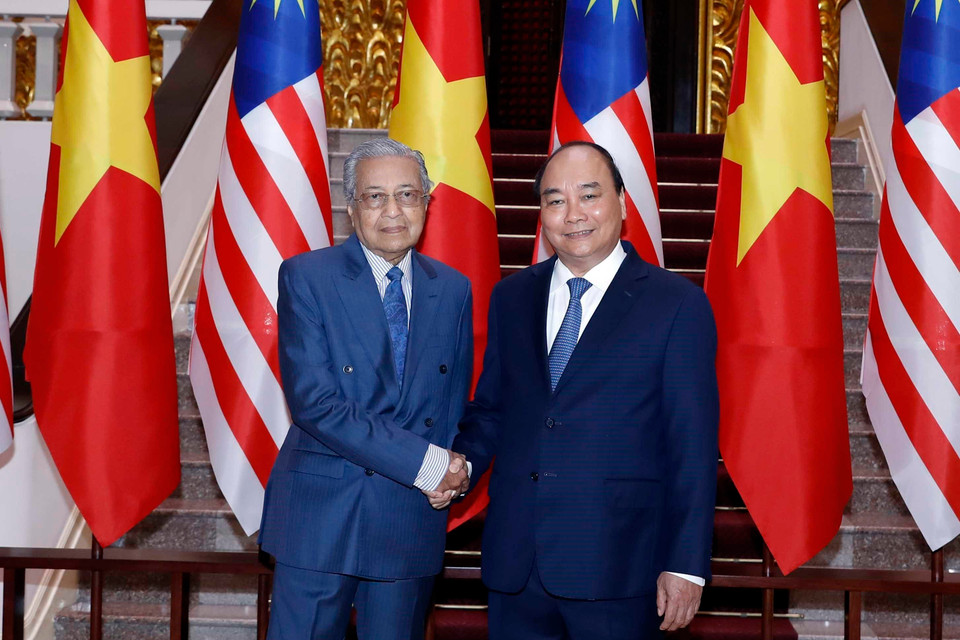 Thủ tướng Nguyễn Xuân Phúc và Thủ tướng Malaysia Mahathir Mohamad tại Trụ sở Chính phủ. (Ảnh: Thống Nhất/TTXVN)