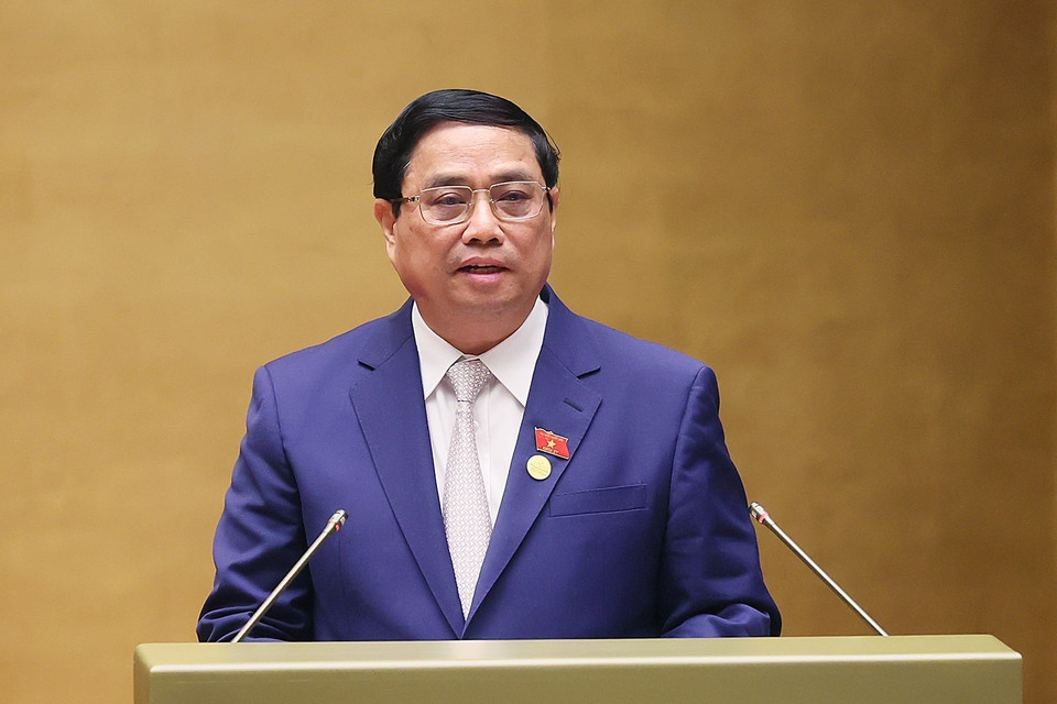 Thủ tướng Phạm Minh Chính trình bày Báo cáo Kết quả Thực hiện Kế hoạch Phát triển Kinh tế-xã hội năm 2023; Dự kiến Kế hoạch Phát triển Kinh tế-Xã hội năm 2024. (Ảnh: Dương Giang/TTXVN)