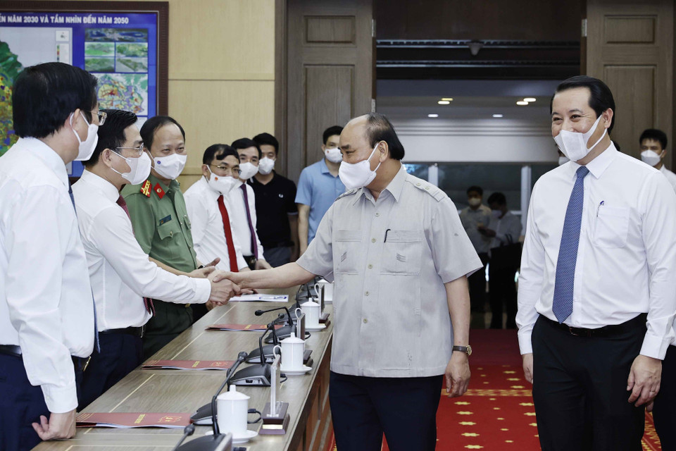 Chủ tịch nước Nguyễn Xuân Phúc với các đại biểu. (Ảnh: Thống Nhất/TTXVN)