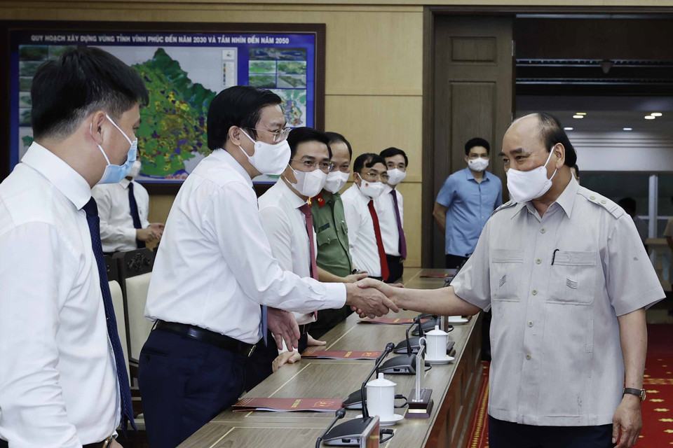 Chủ tịch nước Nguyễn Xuân Phúc với các đại biểu.(Ảnh: Thống Nhất/TTXVN)