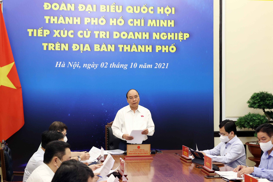 Chủ tịch nước Nguyễn Xuân Phúc và các đại biểu tại điểm cầu Hà Nội. (Ảnh: Thống Nhất/TTXVN)