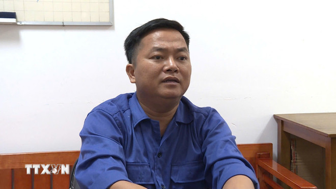 Đối tượng Trần Văn Tuấn tại Cơ quan Công an. (Ảnh: TTXVN phát) ttxvn-tran-van-tuan.jpg