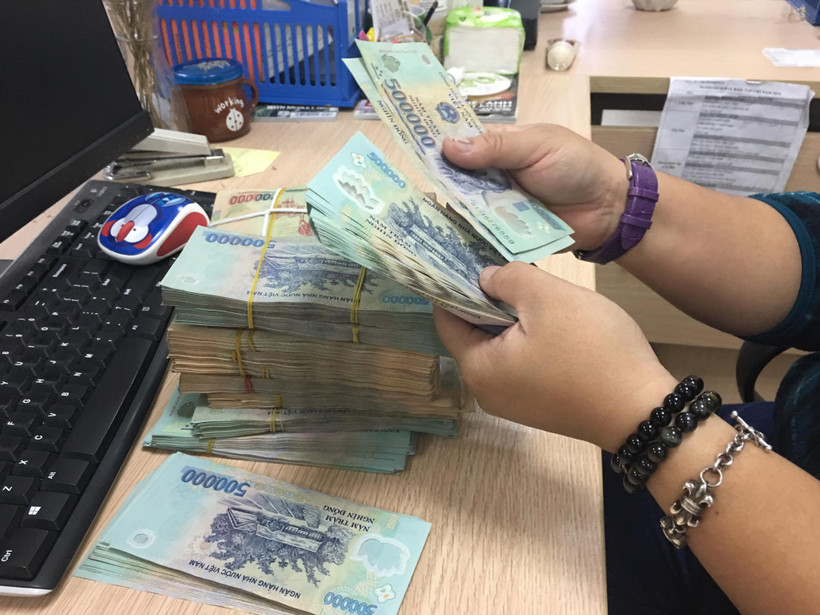 Ngân hàng Nhà nước tăng lãi suất OMO lên 4,5% nhằm giảm áp lực tỷ giá. (Ảnh: Vietnam+)