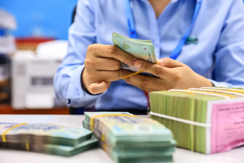 Loạt ngân hàng tăng lãi suất tiết kiệm. (Ảnh: Vietnam+)