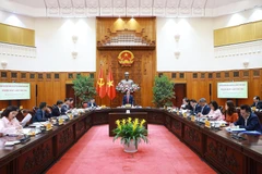 Thủ tướng Phạm Minh Chính chủ trì Phiên họp lần thứ ba của Ban Chỉ đạo quốc gia về tài chính toàn diện. (Ảnh: Dương Giang/TTXVN)