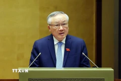 Phó Thủ tướng Thường trực Chính phủ Nguyễn Hòa Bình trình bày Báo cáo tổng kết công tác nhiệm kỳ 2021-2026 của Chính phủ. (Ảnh: Phạm Kiên/TTXVN)