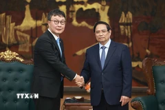 Thủ tướng Phạm Minh Chính tiếp ông Hyoung Nyon Kim, Phó Chủ tịch Tập đoàn Dunamu của Hàn Quốc. (Ảnh: Dương Giang/TTXVN)
