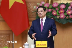 Thủ tướng Phạm Minh Chính tiếp đoàn lãnh đạo doanh nghiệp bán dẫn quốc tế. (Ảnh: Dương Giang/TTXVN)