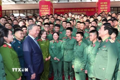 Tổng Bí thư Tô Lâm, Bí thư Quân ủy Trung ương dự chương trình Gặp mặt đại biểu thế hệ trẻ trong Quân đội chiều 18/12/2024. (Ảnh: Trọng Đức/TTXVN)