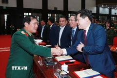 Đại tướng Nguyễn Tân Cương, Ủy viên Trung ương Đảng, Tổng Tham mưu trưởng, Thứ trưởng Bộ Quốc phòng cùng đại biểu dự hội nghị. (Ảnh: Trọng Đức/TTXVN)