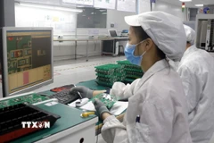 Lao động trong ngành bán dẫn. (Nguồn: TTXVN)