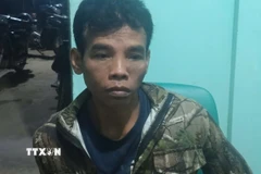 Đối tượng Điểu Trung bị bắt. (Ảnh: TTXVN phát)