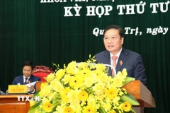 Chủ tịch UBND tỉnh Quảng Trị Lê Hồng Vinh phát biểu nhận nhiệm vụ tại Kỳ họp. (Ảnh: Tá Chuyên/TTXVN)
