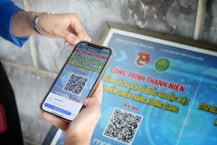 Quét mã QR tìm hiểu về Di tích Lịch sử Quốc gia Đặc biệt Địa điểm Chiến thắng Xương Giang. (Ảnh: Danh Lam/TTXVN)