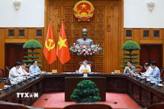 Thủ tướng Lê Minh Hưng chủ trì làm việc với lãnh đạo Bộ Công an và Bộ Khoa học và Công nghệ về xây dựng khung kiến trúc tổng thể quốc gia số. (Ảnh: Dương Giang/TTXVN)
