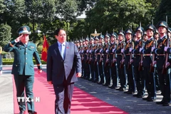 Lễ đón Thủ tướng Phạm Minh Chính đến dự lễ kỷ niệm. (Ảnh: Trọng Đức/TTXVN)