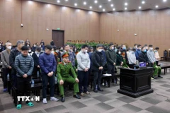 Các bị cáo tại phiên tòa xét xử. (Ảnh: Phạm Kiên/TTXVN)