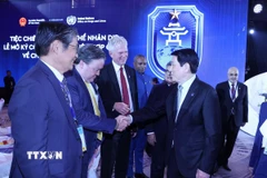 Chủ tịch nước Lương Cường với các đại biểu dự chiêu đãi. (Ảnh: Lâm Khánh/TTXVN)