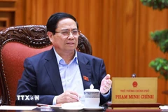 Thủ tướng Phạm Minh Chính chủ trì cuộc họp về tình hình triển khai tuyến đường sắt trọng điểm. (Ảnh: Dương Giang/TTXVN)