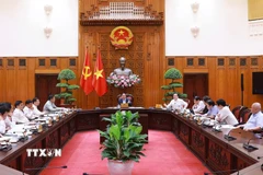 Thủ tướng Phạm Minh Chính chủ trì cuộc họp về tình hình triển khai tuyến đường sắt trọng điểm. (Ảnh: Dương Giang/TTXVN)