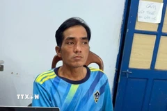 Đối tượng Hợp tại cơ quan công an. (Ảnh: TTXVN phát)