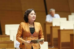 Thống đốc Ngân hàng Nhà nước Việt Nam Nguyễn Thị Hồng giải trình làm rõ ý kiến Đại biểu Quốc hội. (Ảnh: Phương Hoa/TTXVN)