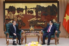 Thủ tướng Phạm Minh Chính tiếp ông Phoxay Sayasone, Bộ trưởng Bộ Lao động và Phúc lợi xã hội Lào. (Ảnh: Dương Giang/TTXVN)