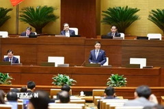 Bộ trưởng Bộ Tài chính Nguyễn Văn Thắng giải trình, làm rõ một số vấn đề đại biểu Quốc hội nêu. (Ảnh: Doãn Tấn/TTXVN)