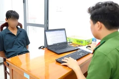 Thạch Thanh Tuấn tại cơ quan công an.