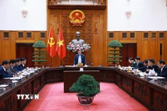 Thủ tướng Phạm Minh Chính chủ trì cuộc họp với lãnh đạo tỉnh Quảng Trị về xây dựng nhà ở cho các gia đình bị thiệt hại do thiên tai tại Quảng Trị. (Ảnh: Dương Giang/TTXVN)