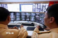 Camera giám sát được bố trí tại gần 200 nút giao khắp thành phố Hà Nội. (Ảnh: Phạm Kiên/TTXVN)