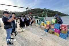 Phóng viên tác nghiệp. (Ảnh minh họa: TTXVN phát)