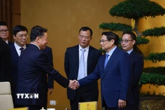 Thủ tướng Phạm Minh Chính tiếp ông Vi Thao, Chủ tịch Khu tự trị dân tộc Choang Quảng Tây, Trung Quốc và đoàn doanh nghiệp sang thăm và làm việc tại Việt Nam. (Ảnh: Dương Giang/TTXVN)