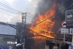 Hiện trường vụ cháy ở phường Phước Long chiều 24/2 (mùng 8 Tết). (Nguồn: TTXVN phát)