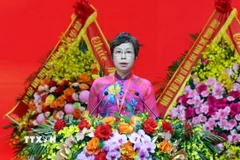 Đồng chí Vũ Việt Trang, Ủy viên Ban Chấp hành Đảng ủy Chính phủ, Bí thư Đảng ủy, Tổng Giám đốc Thông tấn xã Việt Nam trình bày dự thảo Nghị quyết Đại hội. (Ảnh: Phạm Kiên/TTXVN)