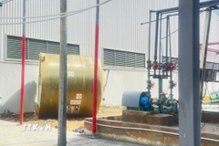 Hiện trường vụ nổ bình chứa axit tại Nhà máy HC (chuyên sản xuất hóa chất tại thôn 20 Lộc Thắng, xã Bảo Lâm 1). (Ảnh: TTXVN phát)