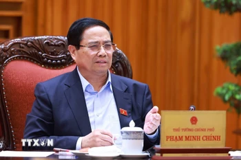 Thủ tướng Phạm Minh Chính chủ trì cuộc họp về tình hình triển khai tuyến đường sắt trọng điểm. (Ảnh: Dương Giang/TTXVN)