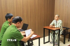 Đối tượng Mỹ tại cơ quan công an. (Ảnh: Đậu Tất Thành/TTXVN)