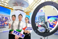 Khu vực trưng bày của Thông tấn xã Việt Nam tại Triển lãm thành tựu đất nước giới thiệu nhiều phương thức truyền thông hiện đại. (Ảnh minh họa: TTXVN)